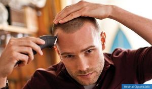 man cutting his hair with Remington #HC5870 Virtually Indestructible Cordless Barbershop Haircut Kit.